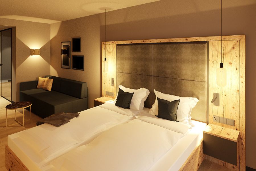 Hoteleinrichtung mit Doppelbett und Sofa im Hotel Waldfriede